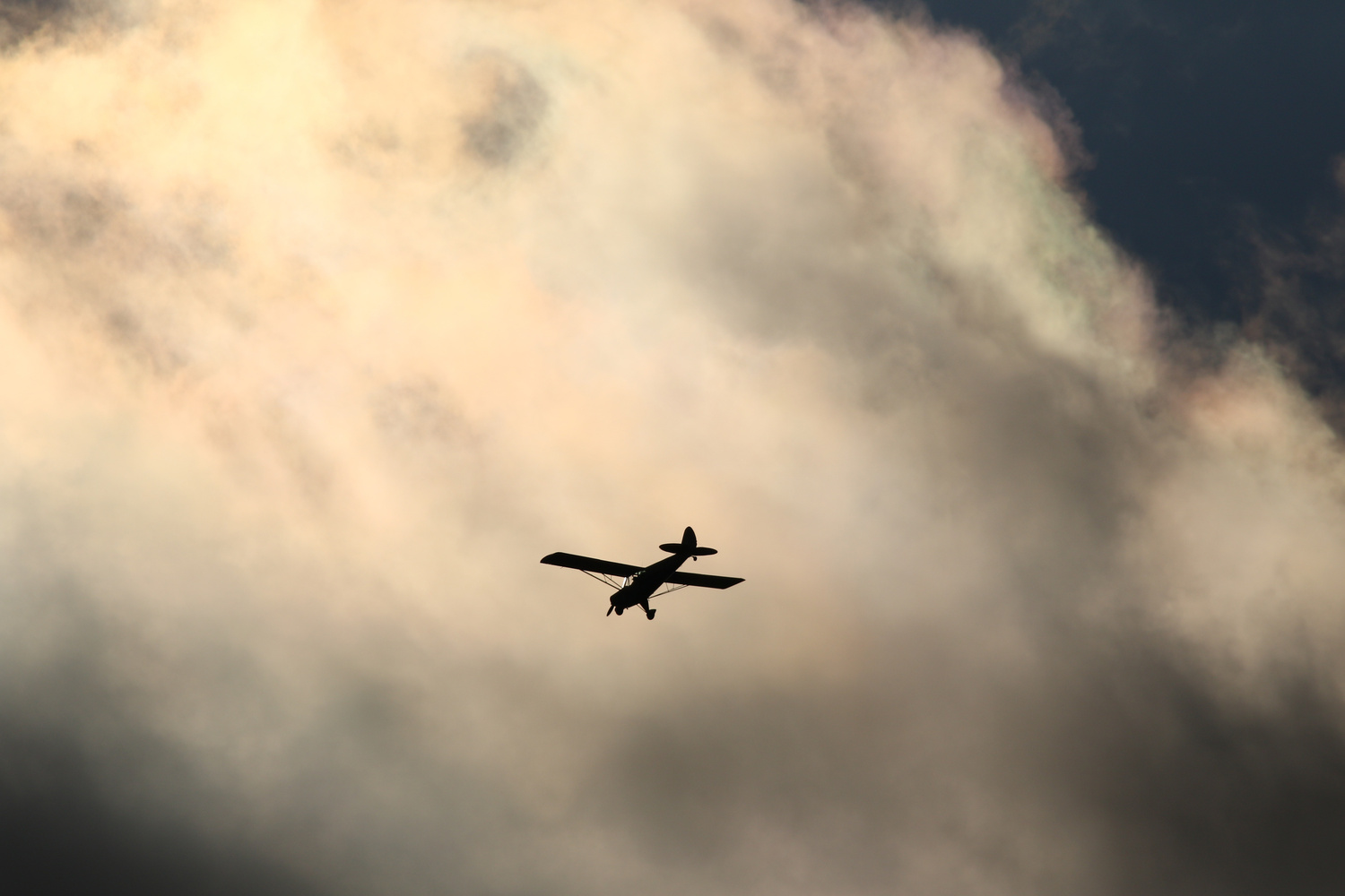 Airplane flying into the clouds