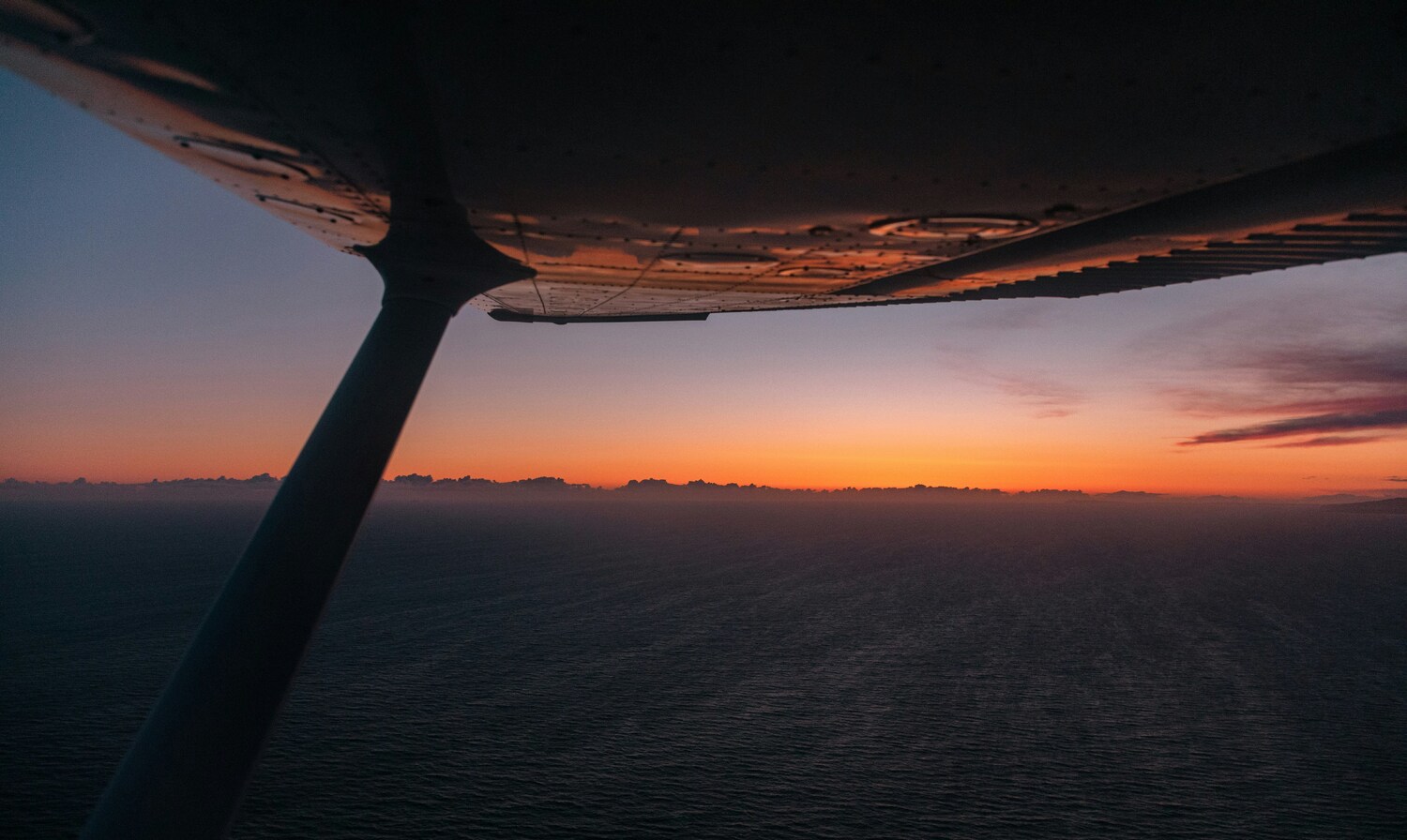 Flying over the water at night